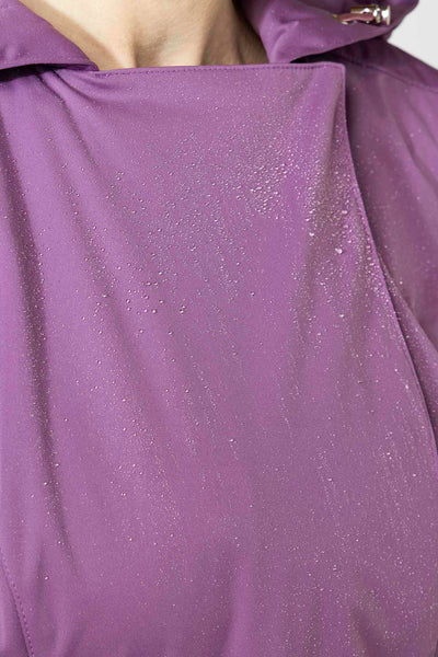 Water droplets on violet waterproof trench coat fabric showing water resistance
