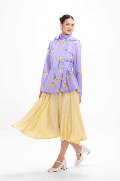 Model in motion wearing soft violet waterproof women's jacket with elegant silhouette
