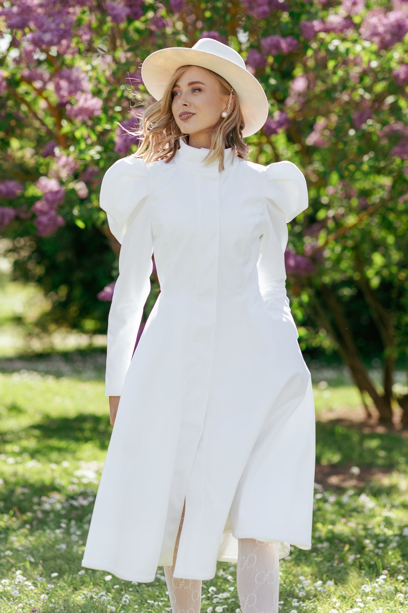 Woman wearing elegant white wedding coat styled as bridal outerwear for special occasions