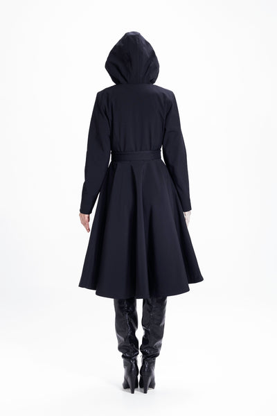 Back view of black women's flared coat with fitted waist and full skirt design