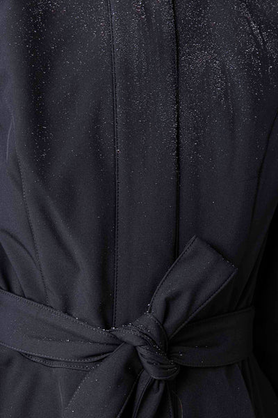 Close-up of waterproof membrane outerwear fabric on elegant women's fit and flare coat