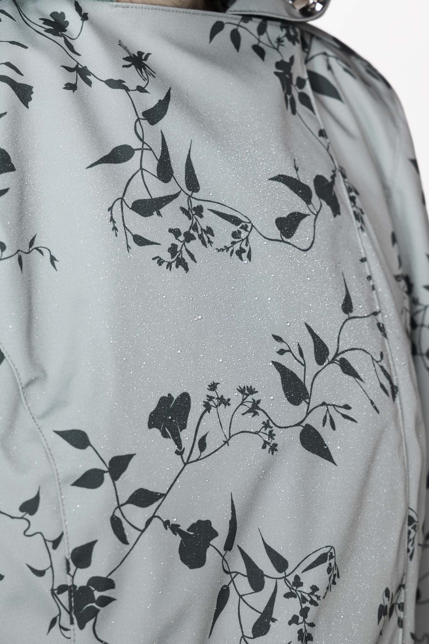 Dark green floral print detail on pastel mint women's designer trench coat