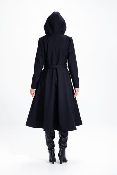 Back view of black double-breasted women's coat with structured waist fit