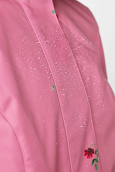Close-up of pink floral pattern on soft water-resistant women's fit and flare coat by RainSisters
