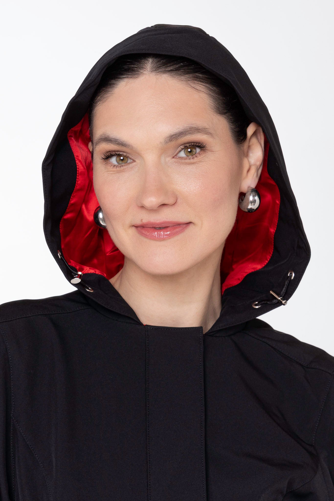 Close-up of hood detail on Raven Red black women's designer coat