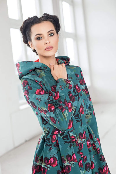Pleated skirt on green floral women's coat with feminine silhouette