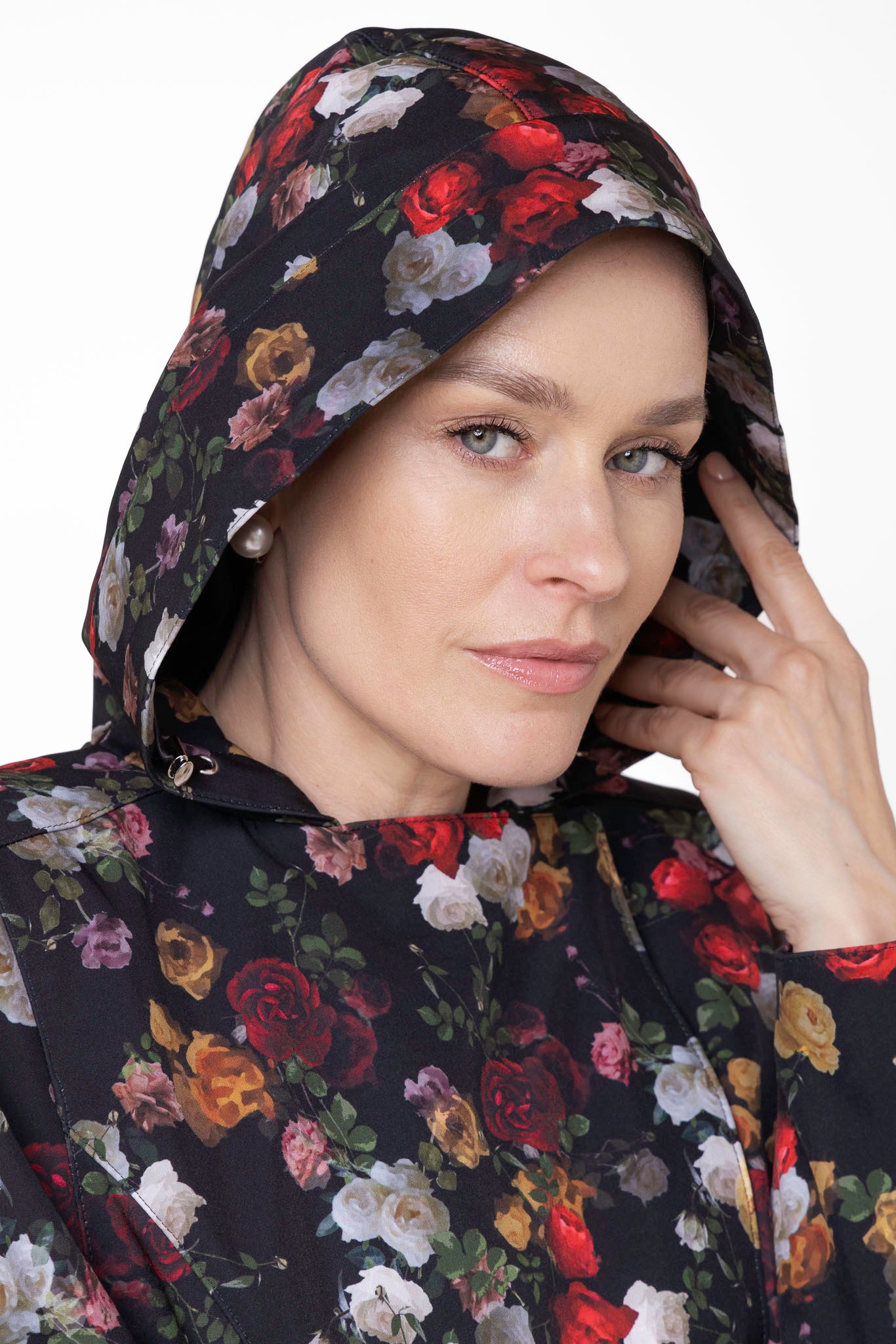Close-up of hood detail on black floral weatherproof women's coat with vintage floral design