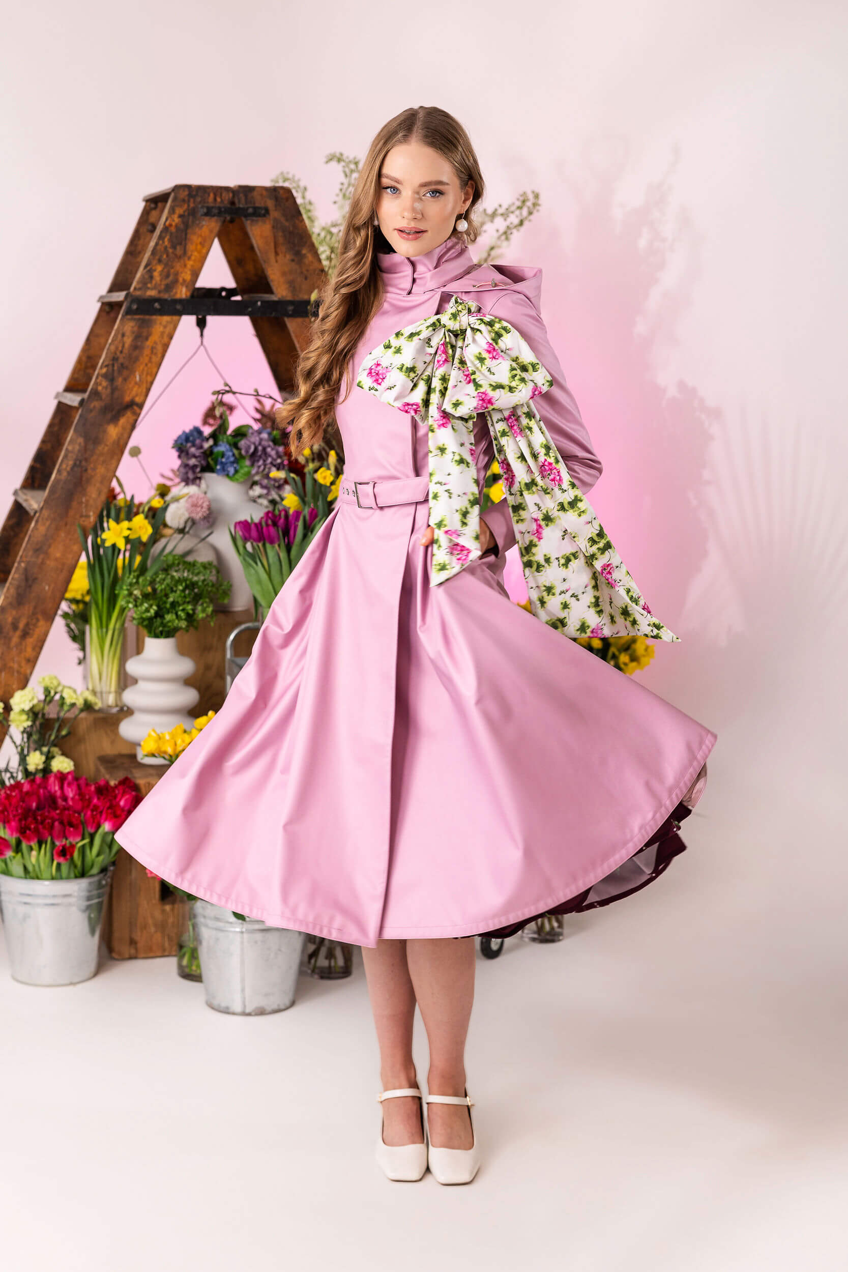 Women’s double-breasted waterproof coat with removable floral scarf detail