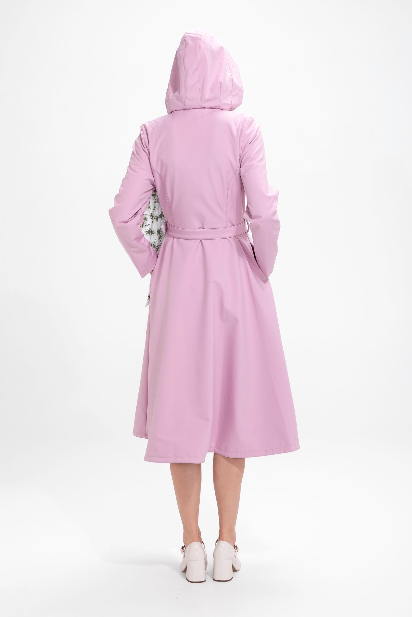 Back view of pink double-breasted waterproof women's coat with matching belt