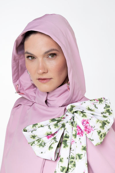 Close-up of hood detail on soft pink waterproof trench coat by RainSisters