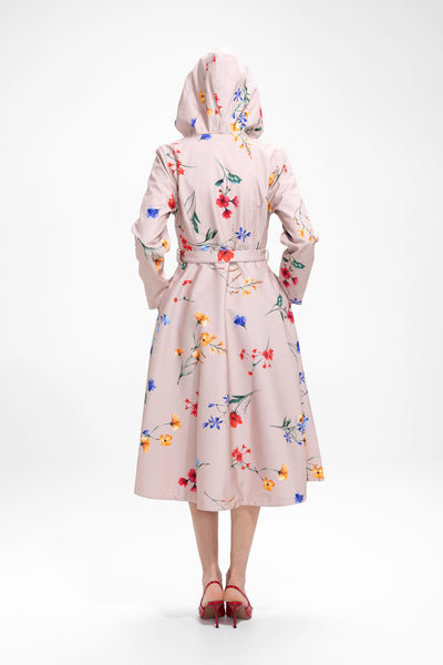 Back view of beige women's floral trench coat with tailored silhouette and defined waist