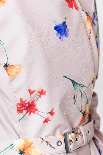 Blue, red, violet and golden yellow flower print detail on waterproof beige women's designer trench coat