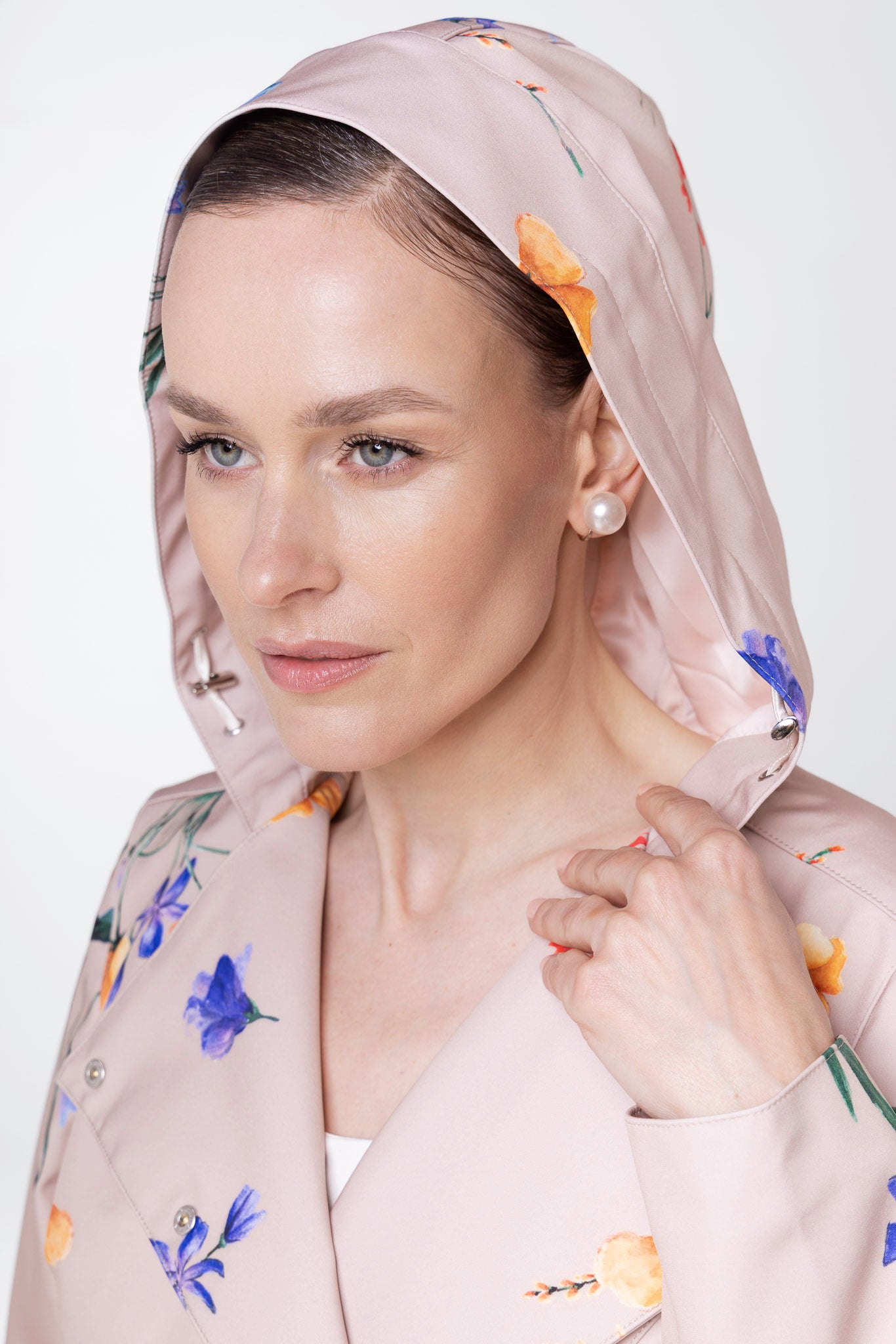 Close-up of hood detail on Spring Bloom beige floral women's coat