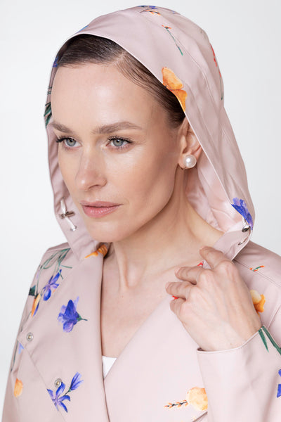 Close-up of hood detail on Spring Bloom beige floral women's coat