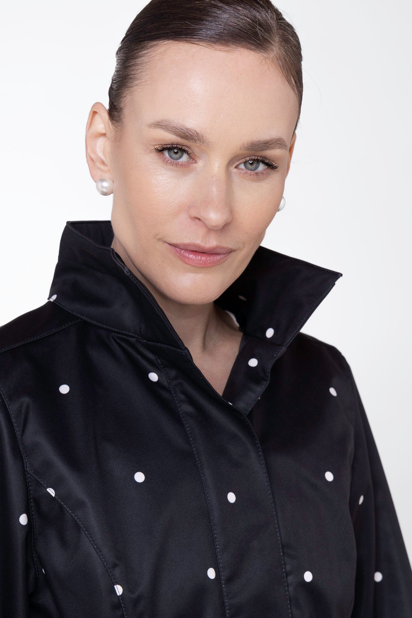 Detachable hood detail on Timeless Polka Dots black water-resistant women's coat