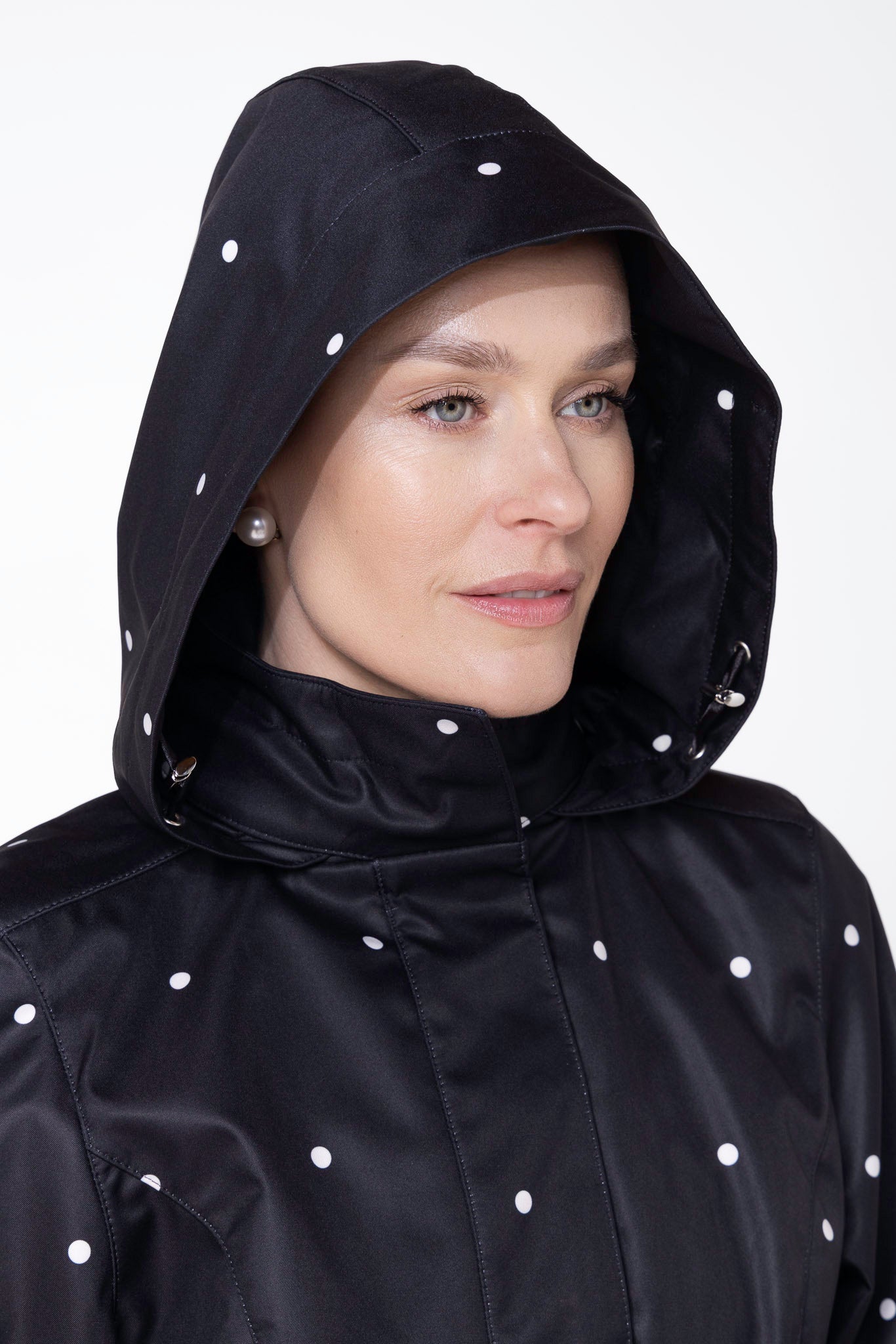 Close-up of hood detail on Timeless Polka Dots black water-resistant women's coat