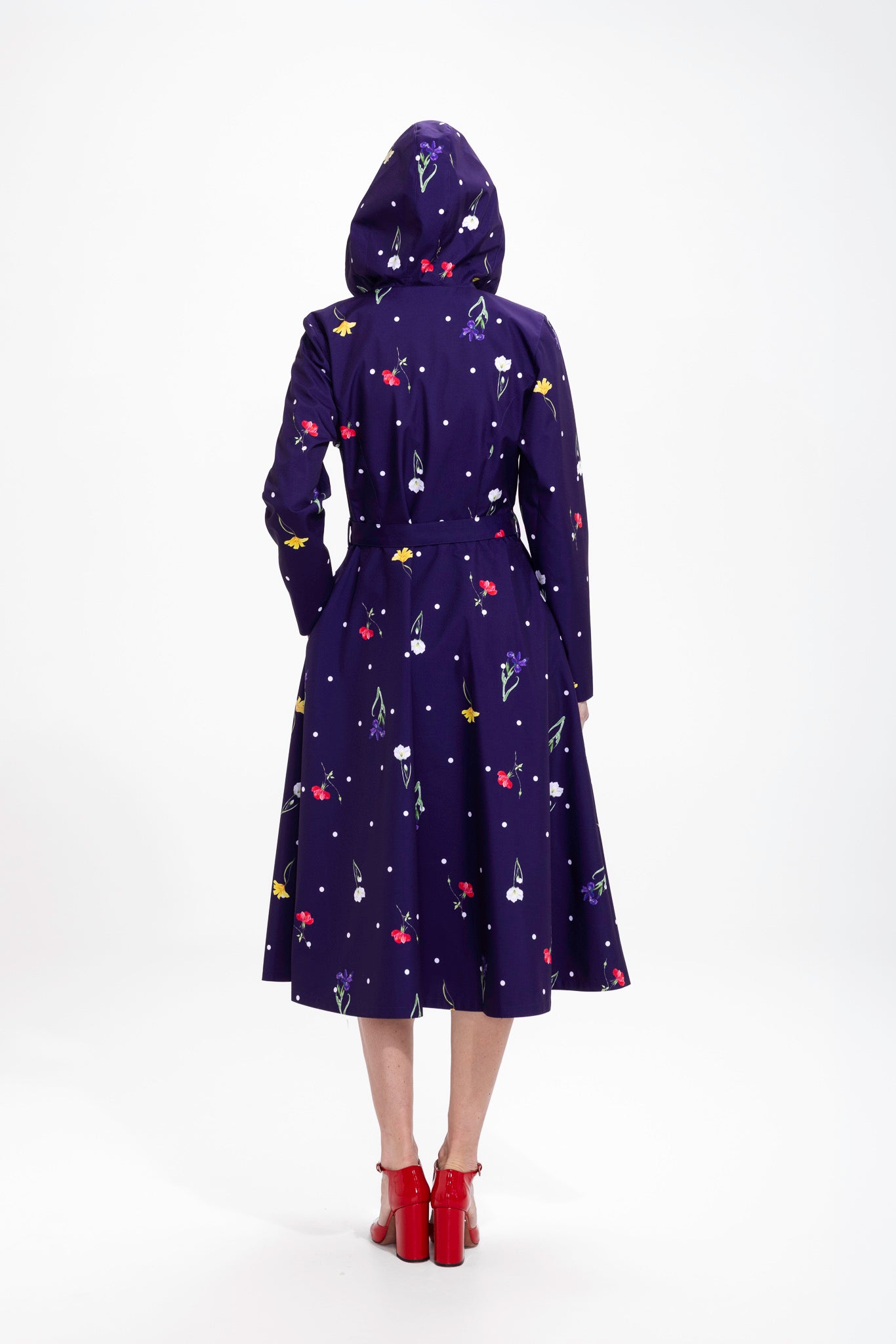 Back view of purple floral women's coat with feminine fit and matching belt