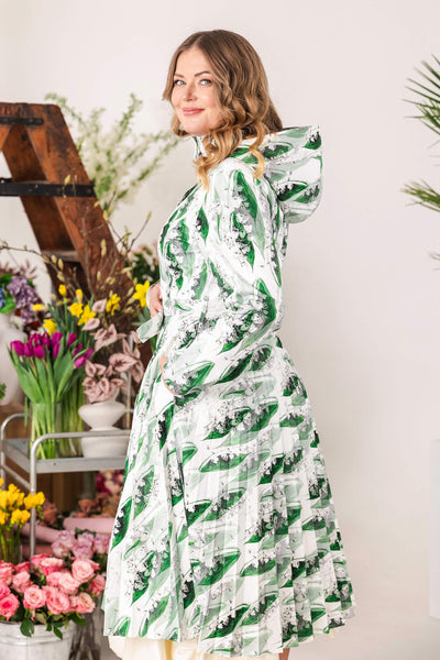 Belted green floral trench coat in white and greenish color