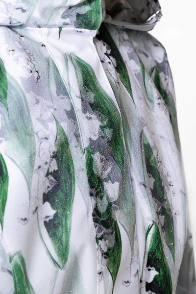 Water droplets on white-green waterproof coat fabric demonstrating water resistance