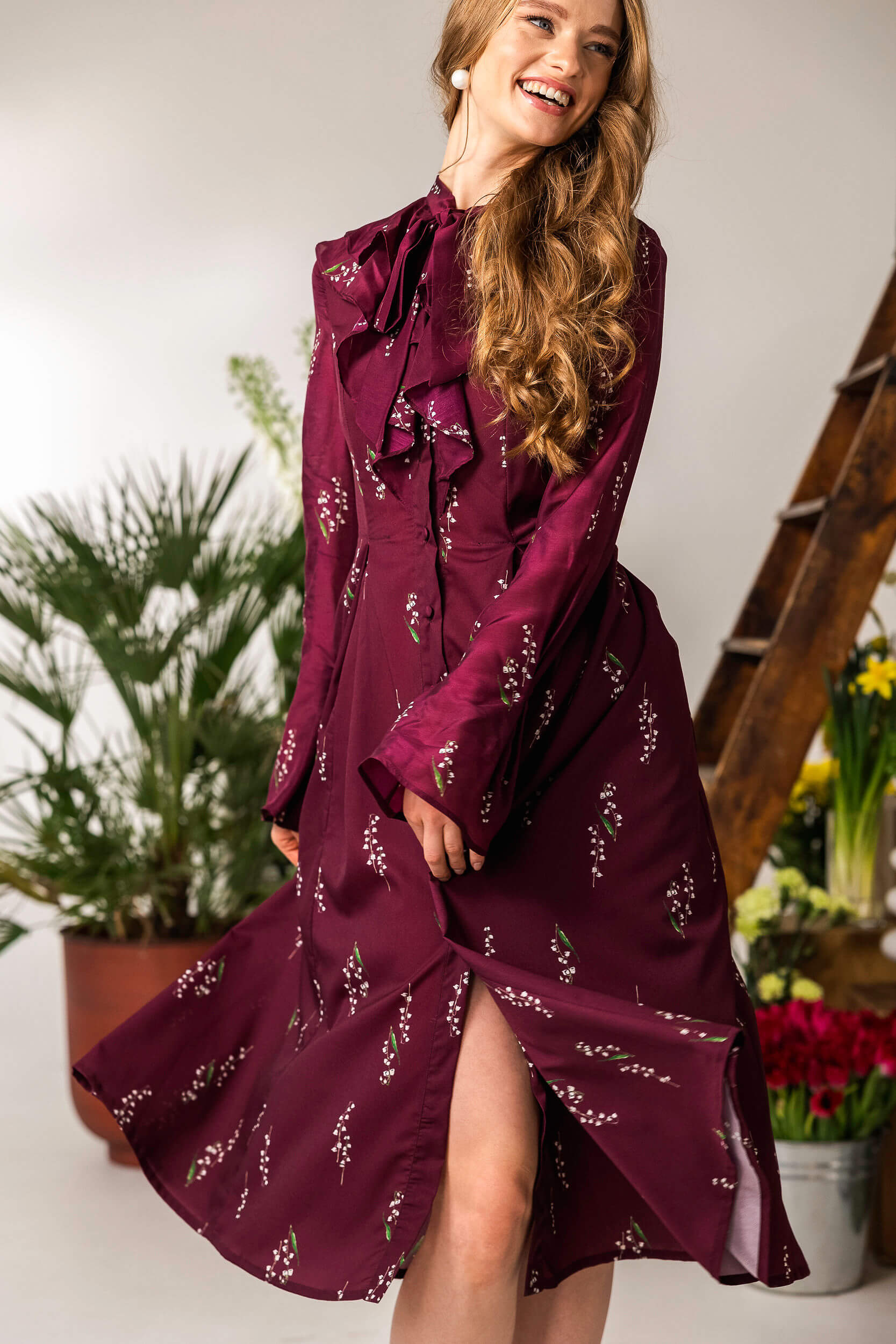 Romantic floral midi dress with fitted waist and flowing skirt