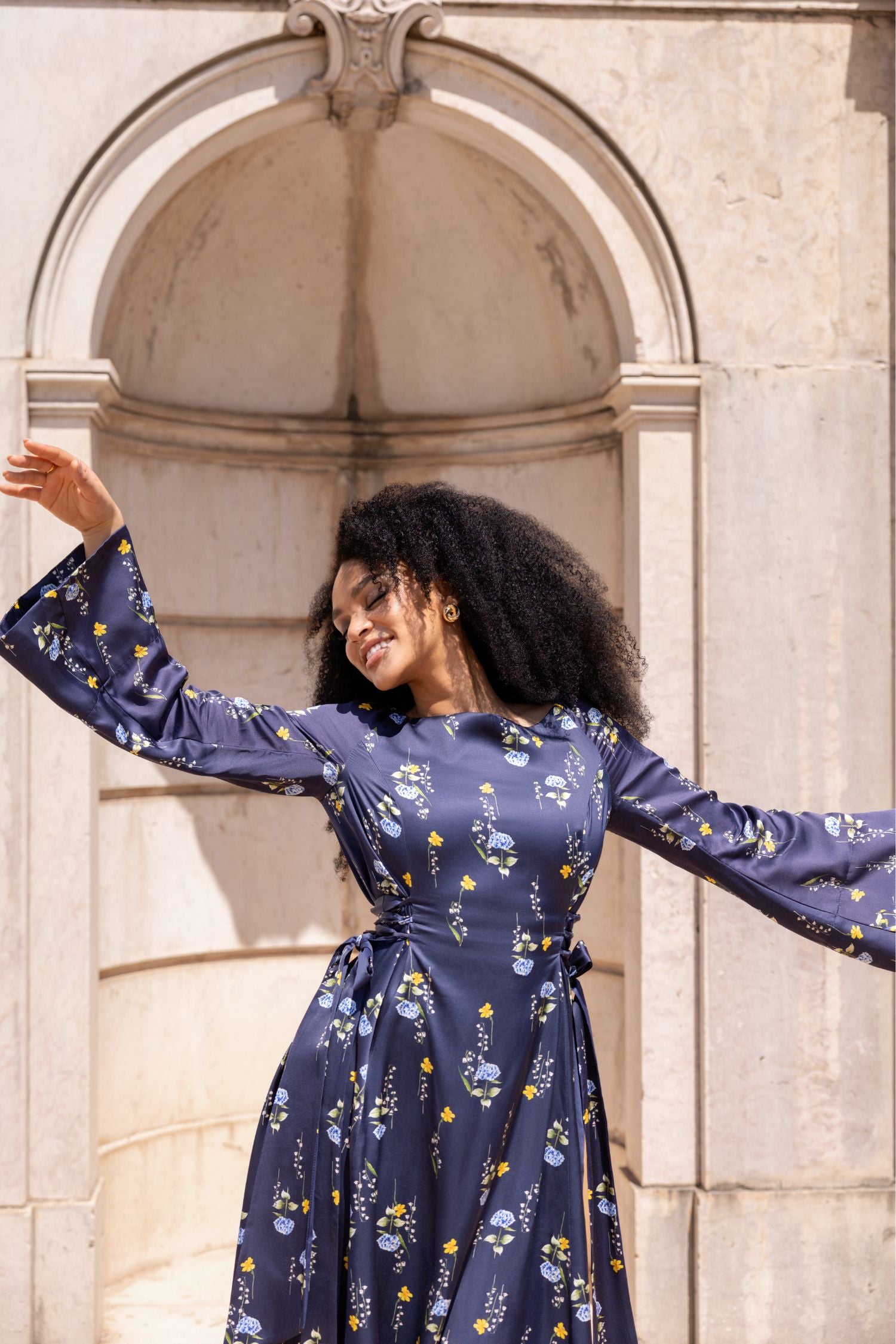 Close-up of the Meadow Dream midi dress showing luxurious viscose rayon fabric and adjustable waist detail