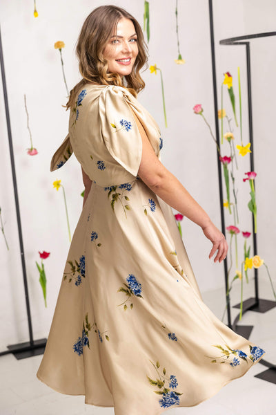 Wrap-front V-neck dress with flowing midi skirt