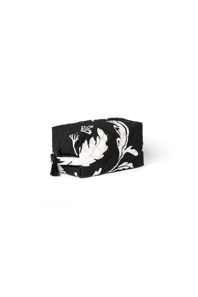 Large black cosmetic bag with white floral print, black zipper closure, and decorative tassel detail
