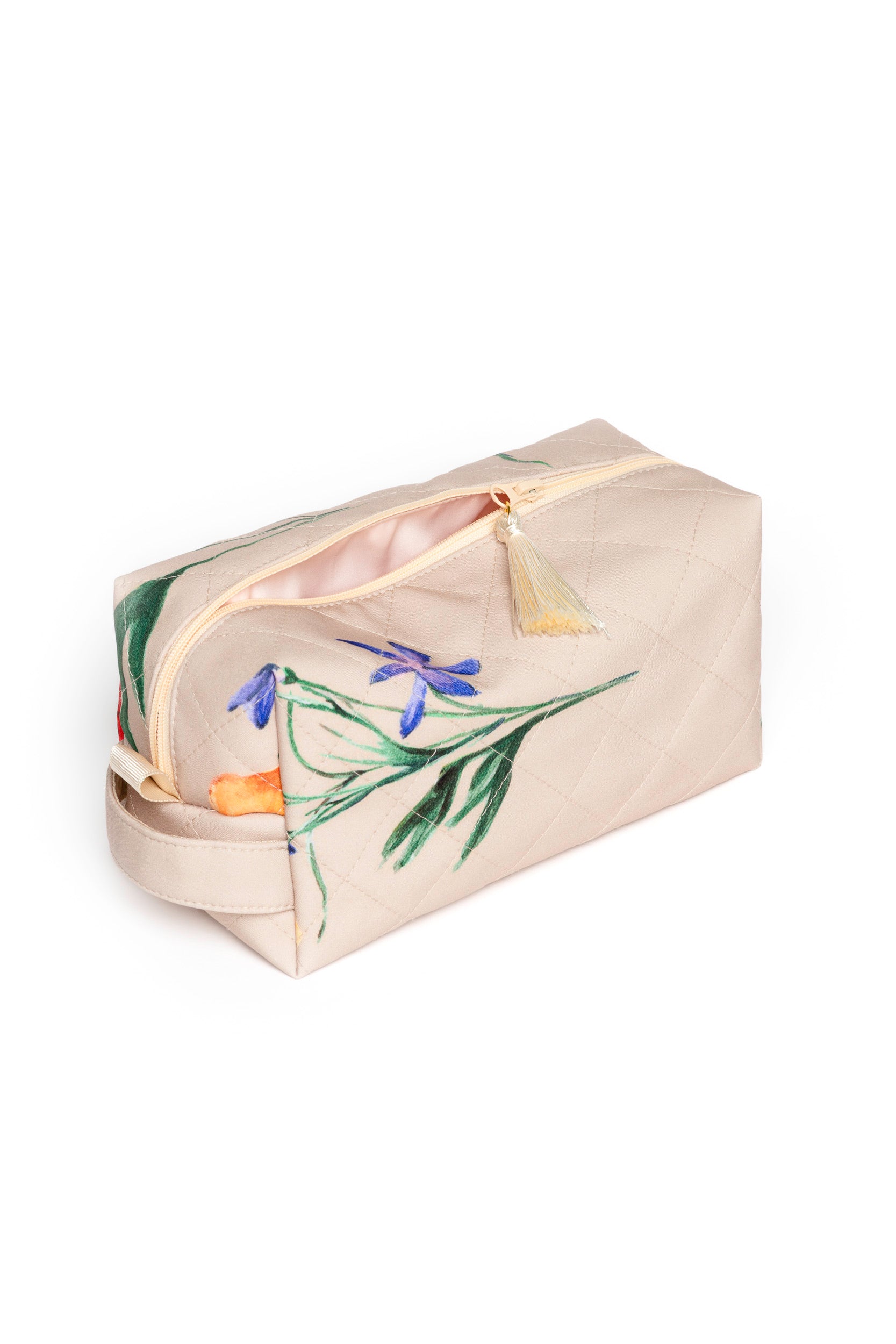 Small beige floral makeup pouch opened to reveal pink lining and compact storage for beauty essentials