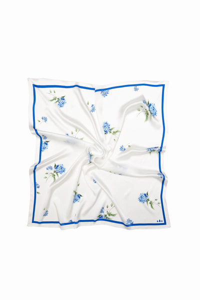 White square scarf with blue floral pattern on a white background