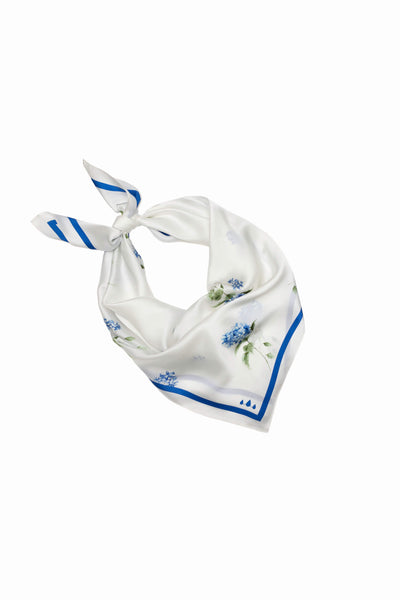 White scarf with blue floral patterns on a white background
