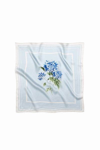 Light blue natural silk scarf with flower print on it.