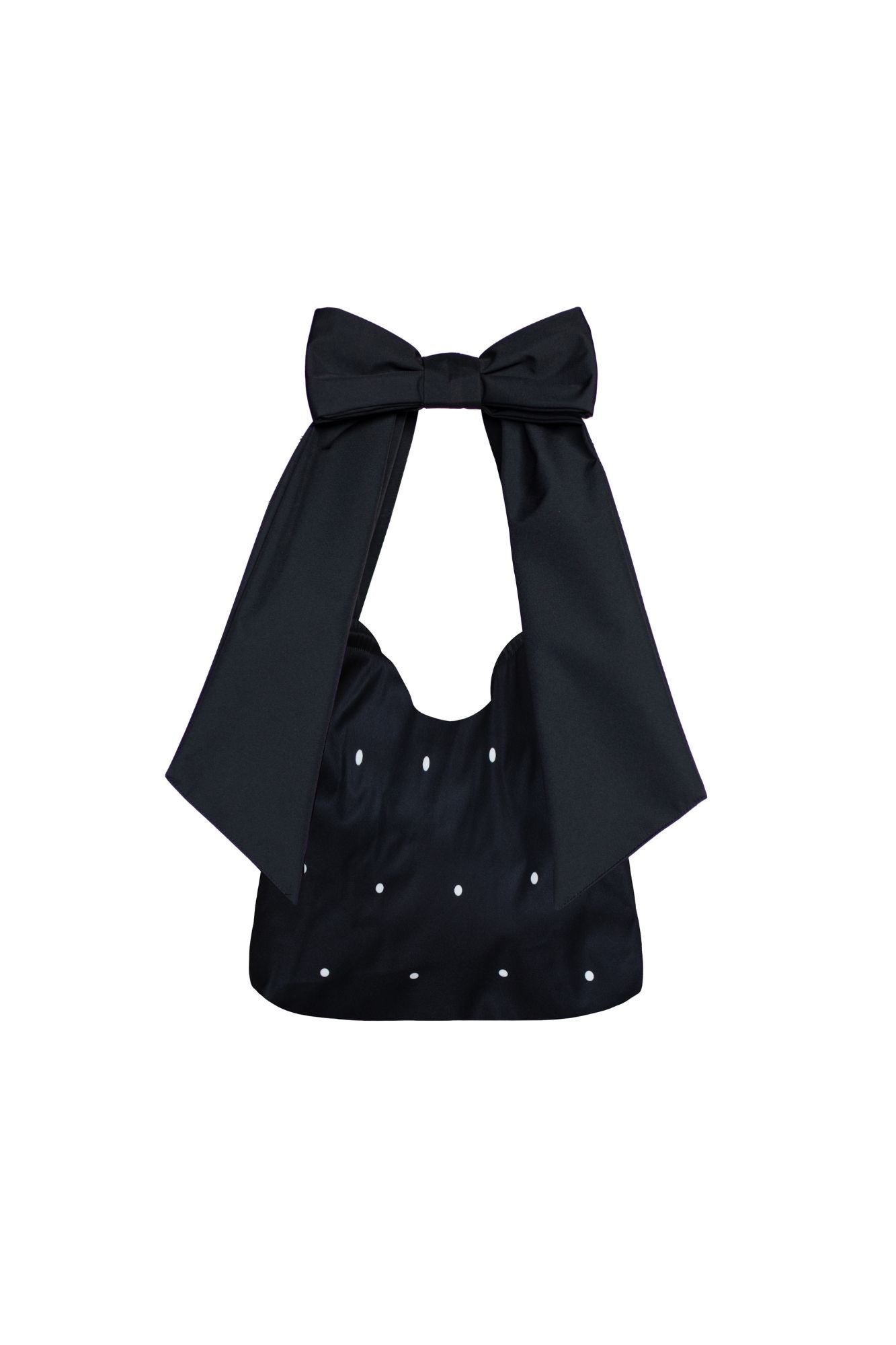 Black tote bag with bow detail and white polka dot print on a white background