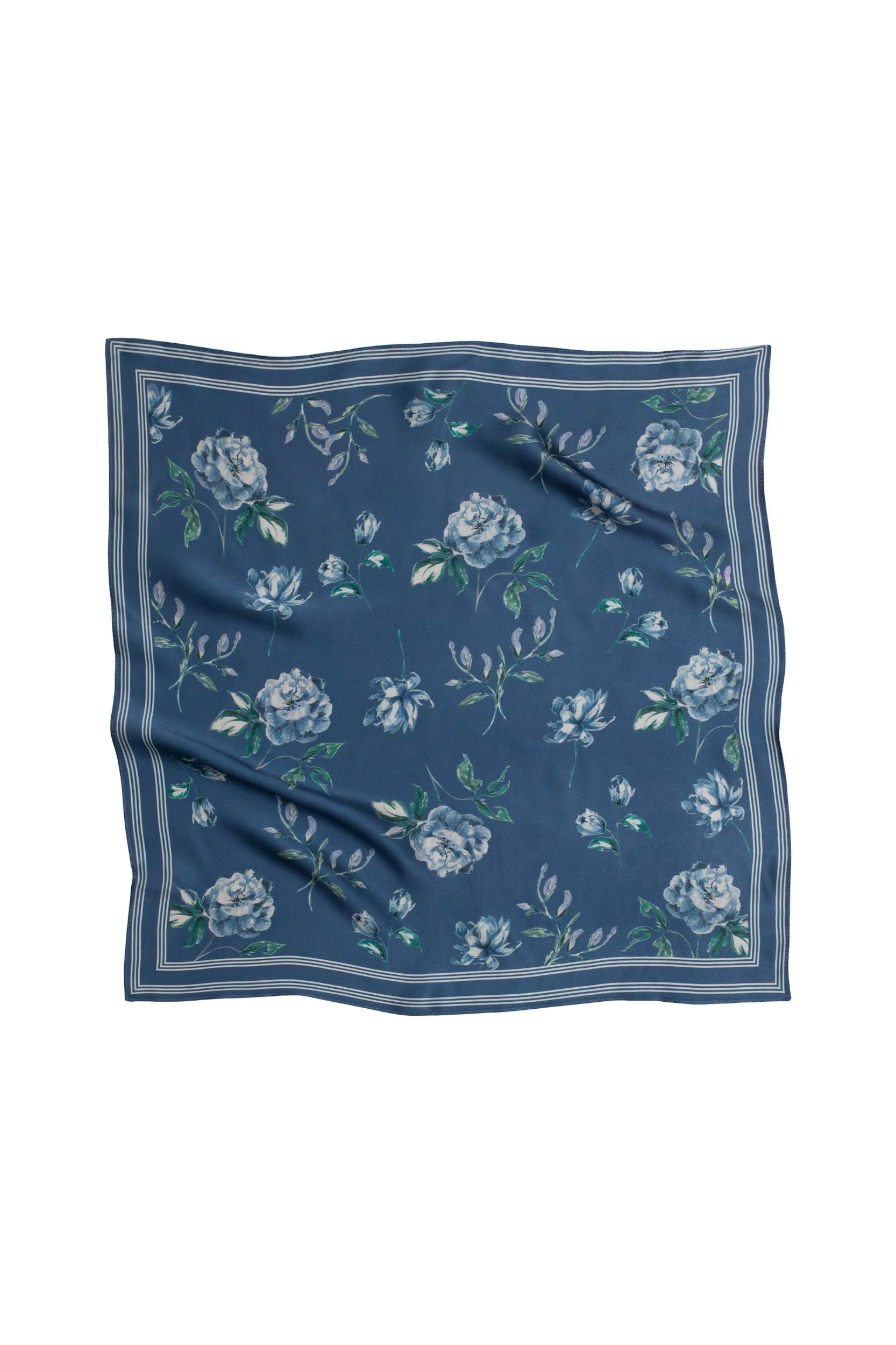Blue floral patterned square scarf on a white background