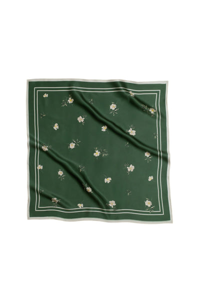 Green square scarf with floral patterns on a white background