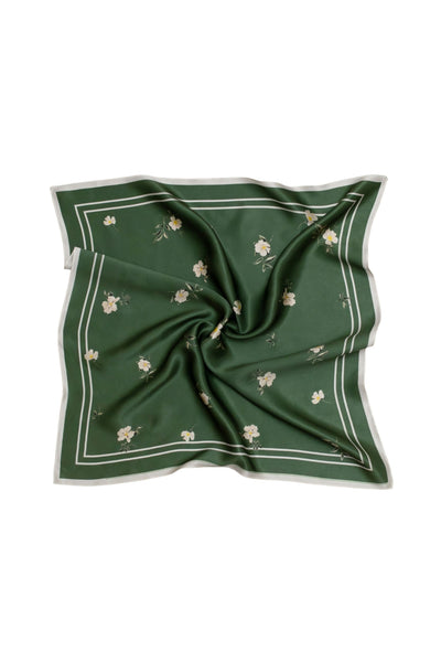 Green square scarf with floral patterns on a white background