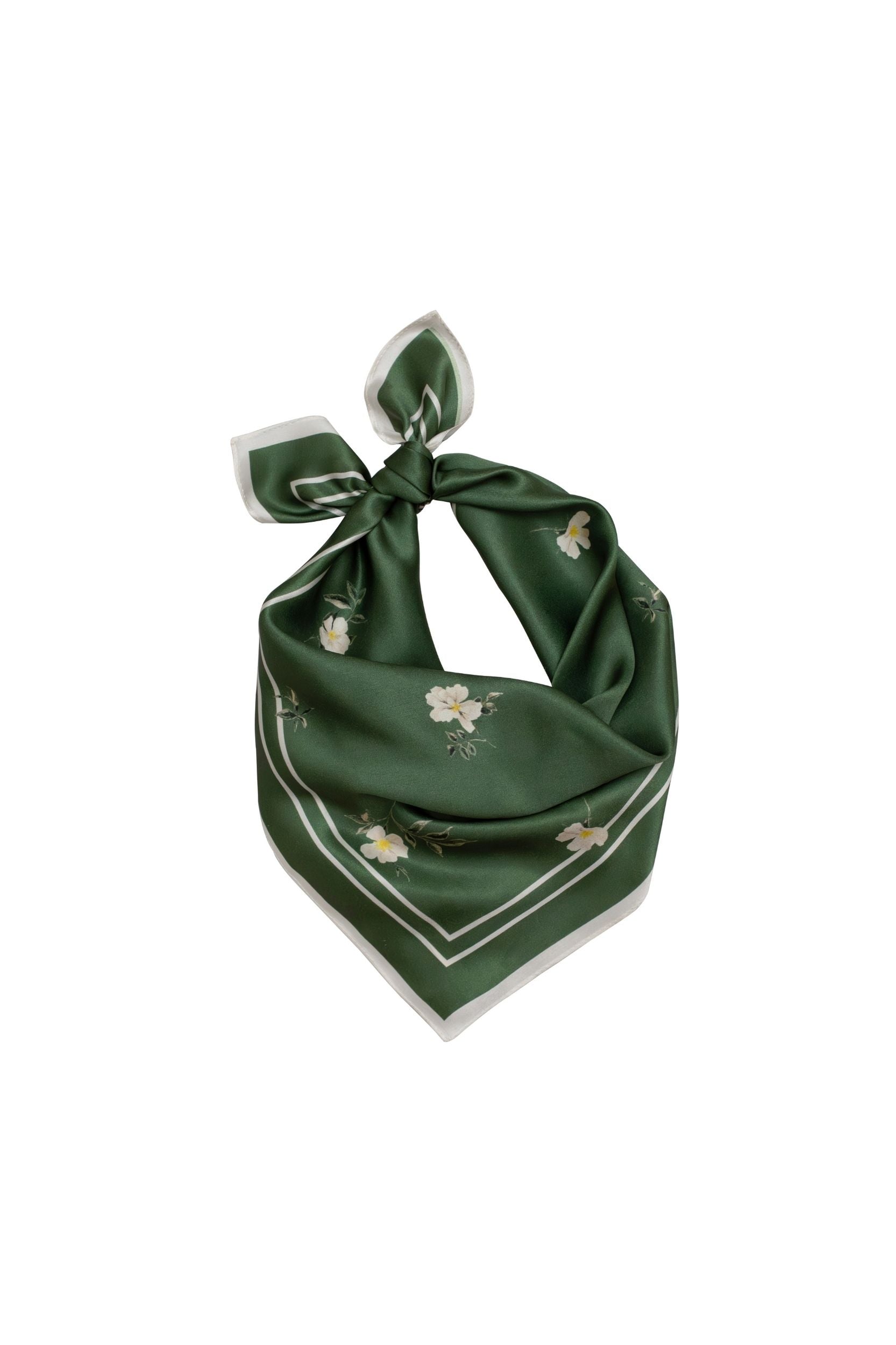 Green floral scarf tied in a knot on a white background