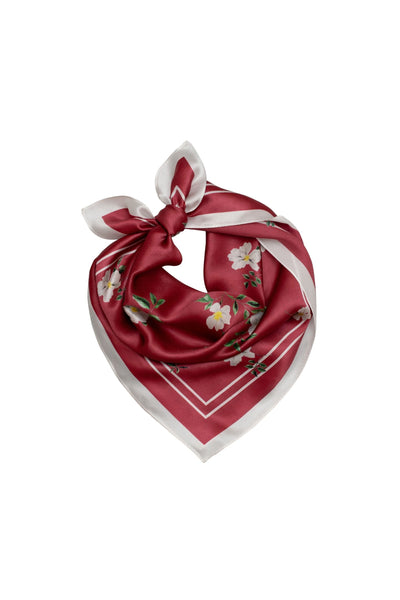 Red floral scarf with white border on a white background