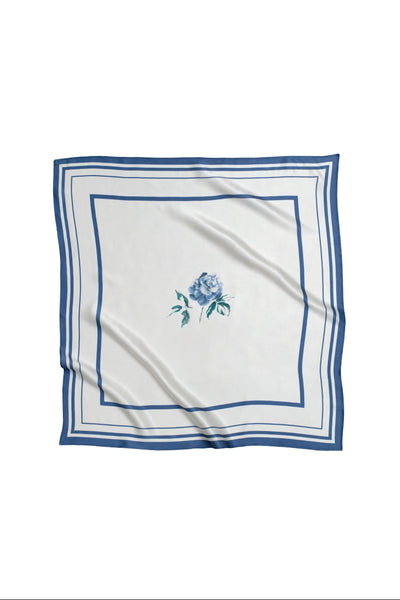 White square scarf with blue floral design and border on a white background