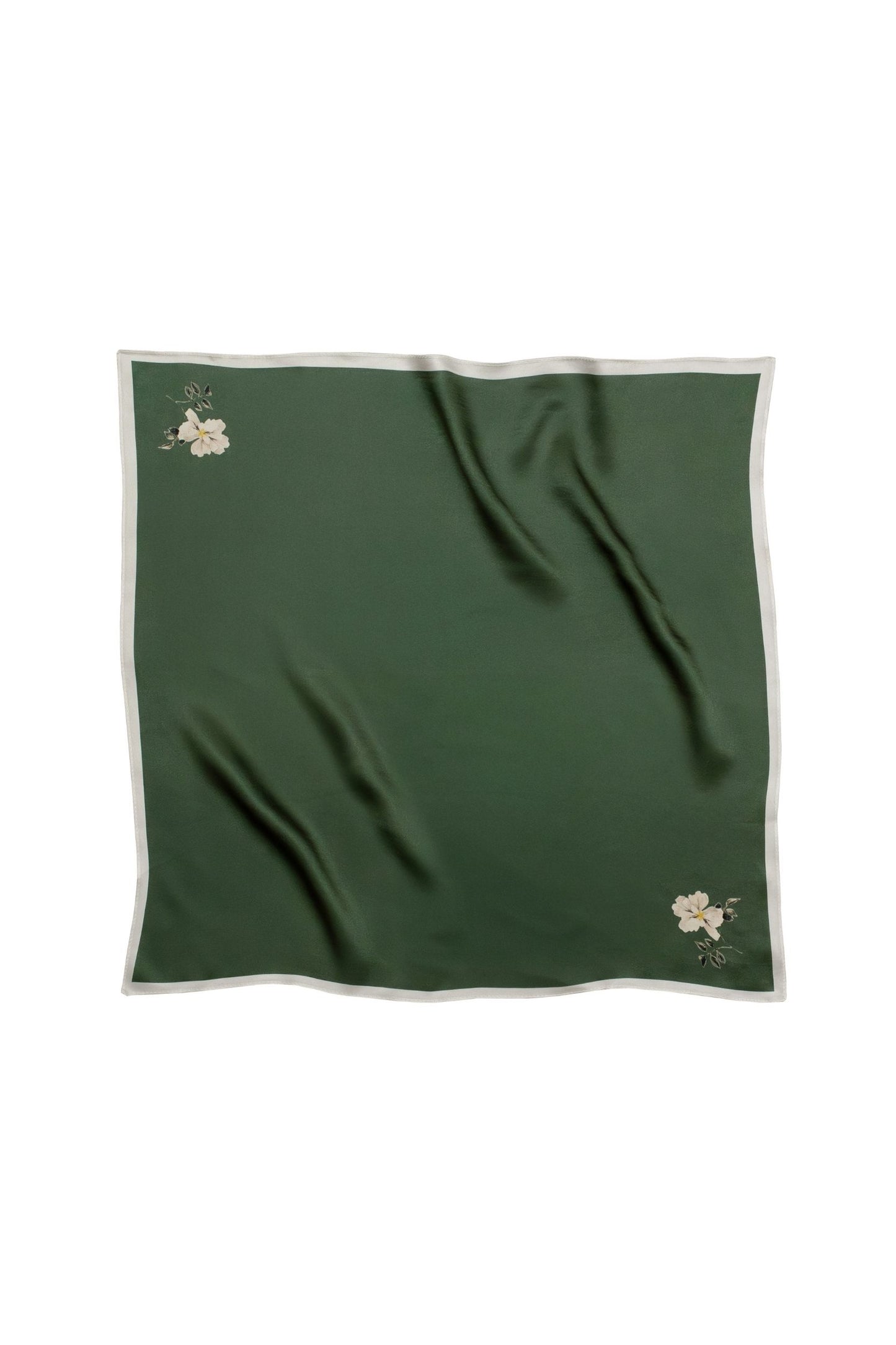 Green fabric with floral minimalistic print on a white background