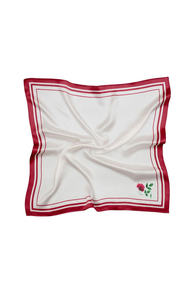 White square scarf with red border and small rose on a white background