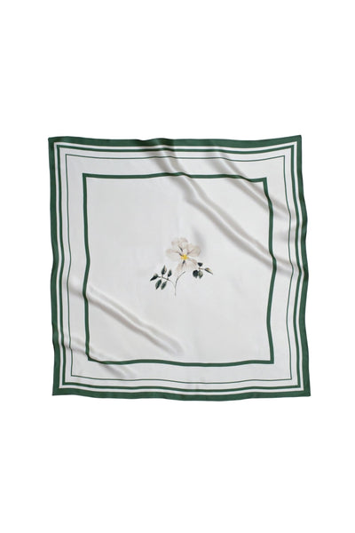 White square scarf with floral print and green border on a white background