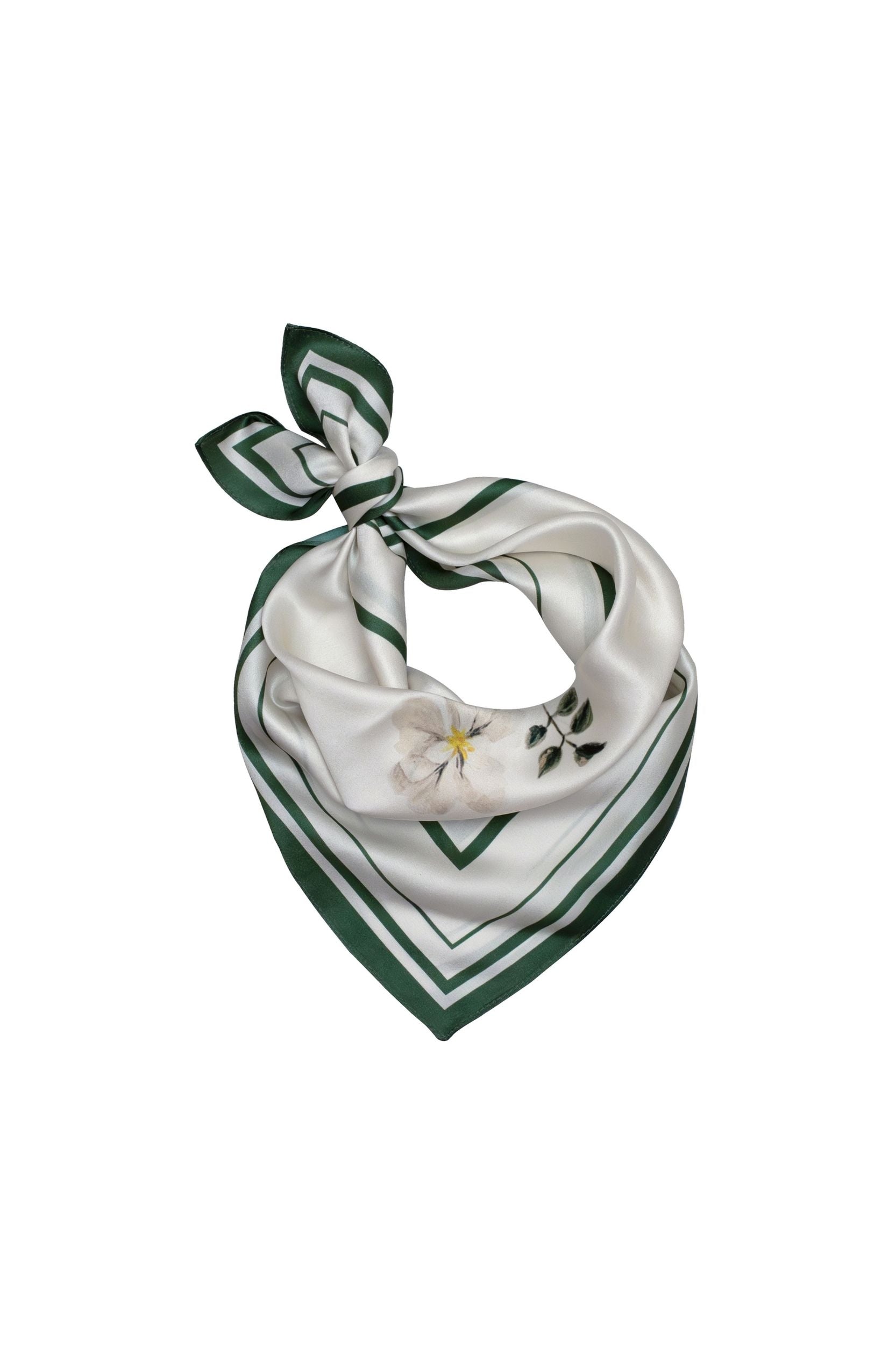 Green and white floral patterned scarf on a white background