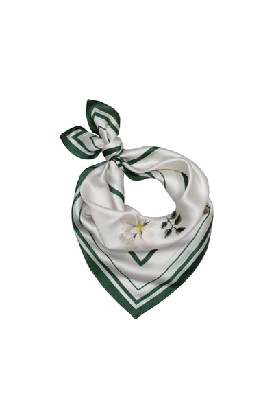 Green and white floral patterned scarf on a white background