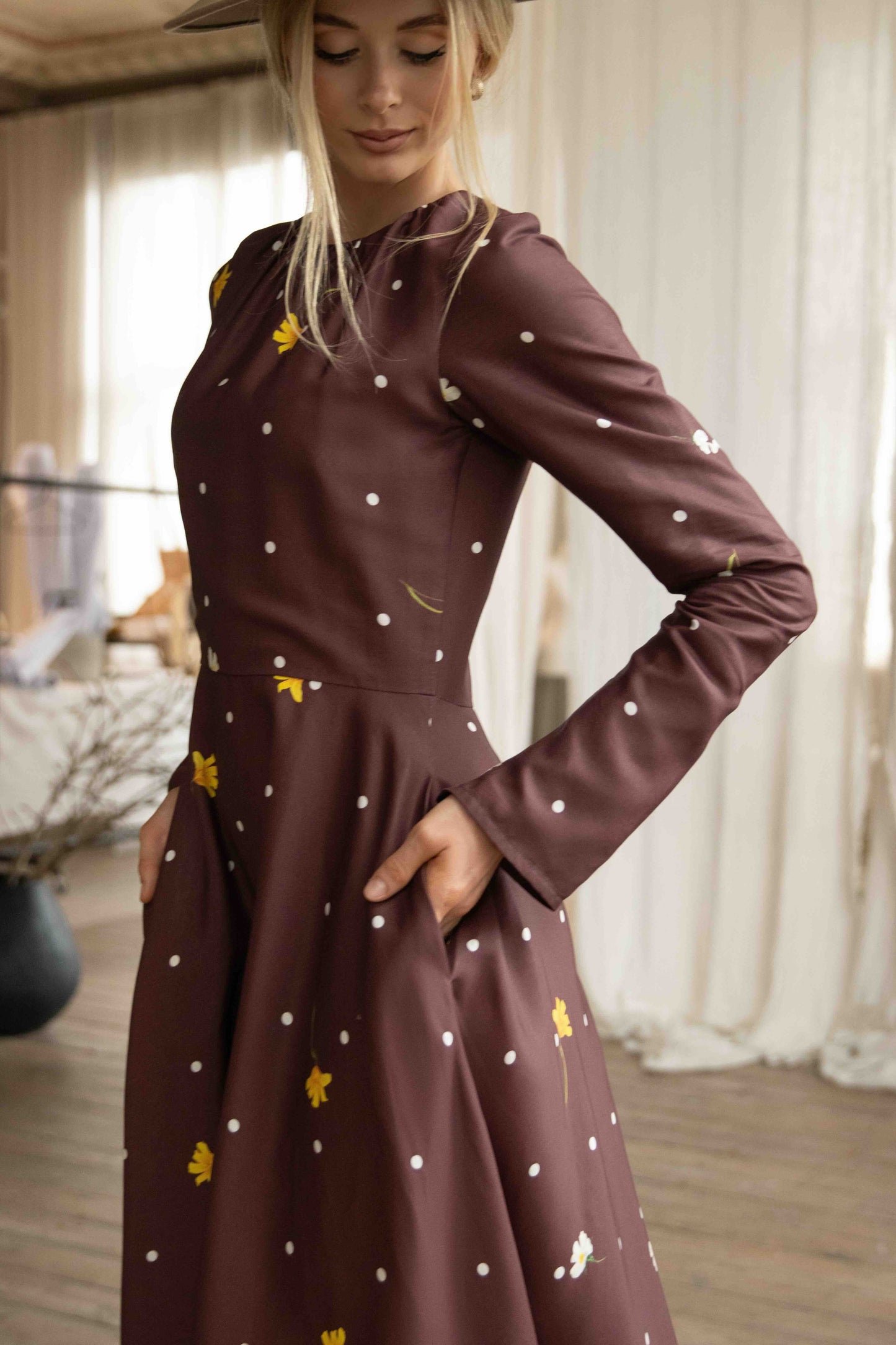 Elegant polka dot and floral midi dress with soft satin drape, perfect for vintage-inspired style lovers.