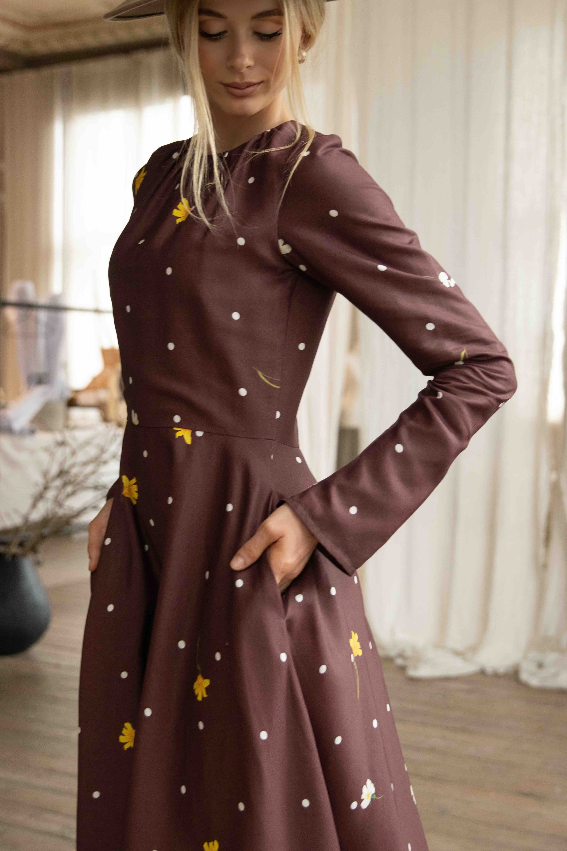 Elegant polka dot and floral midi dress with soft satin drape, perfect for vintage-inspired style lovers.