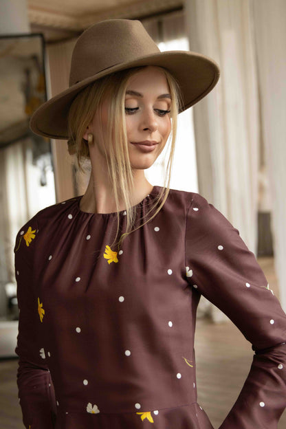 Brown viscose satin midi dress with feminine silhouette, gathered neckline, and romantic long sleeves.