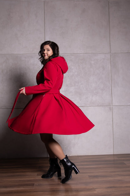 bright red fitted coat with pleated back