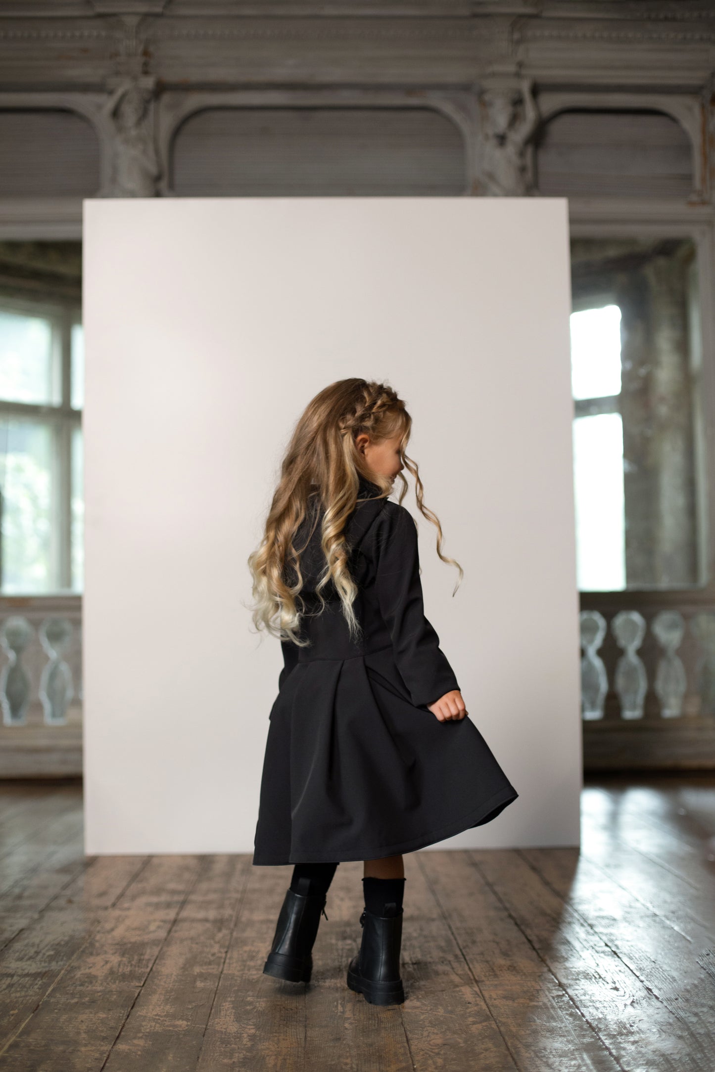 Flared black raincoat for girls with pleated back