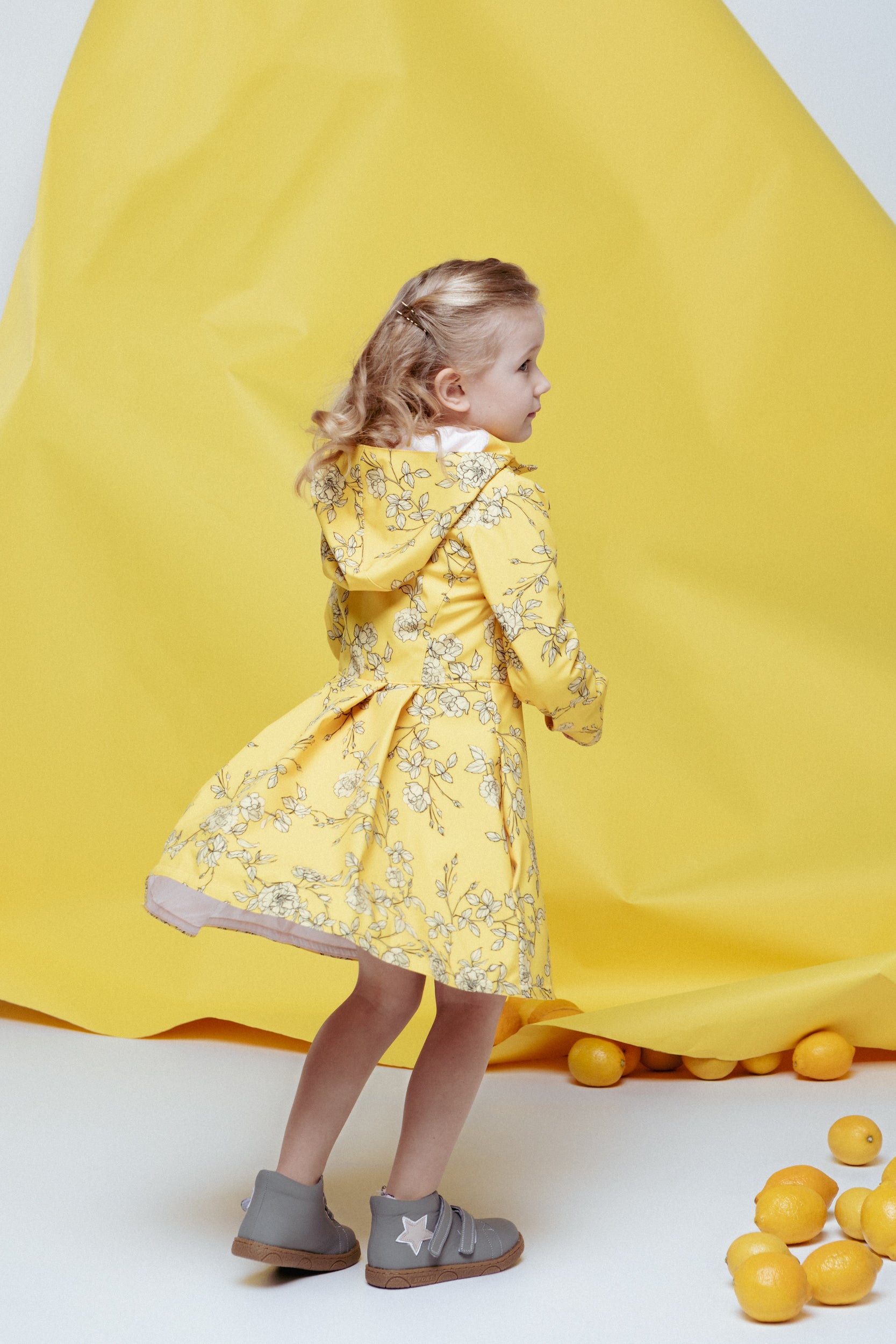 Yellow Rain Jacket with Print and pleating on back