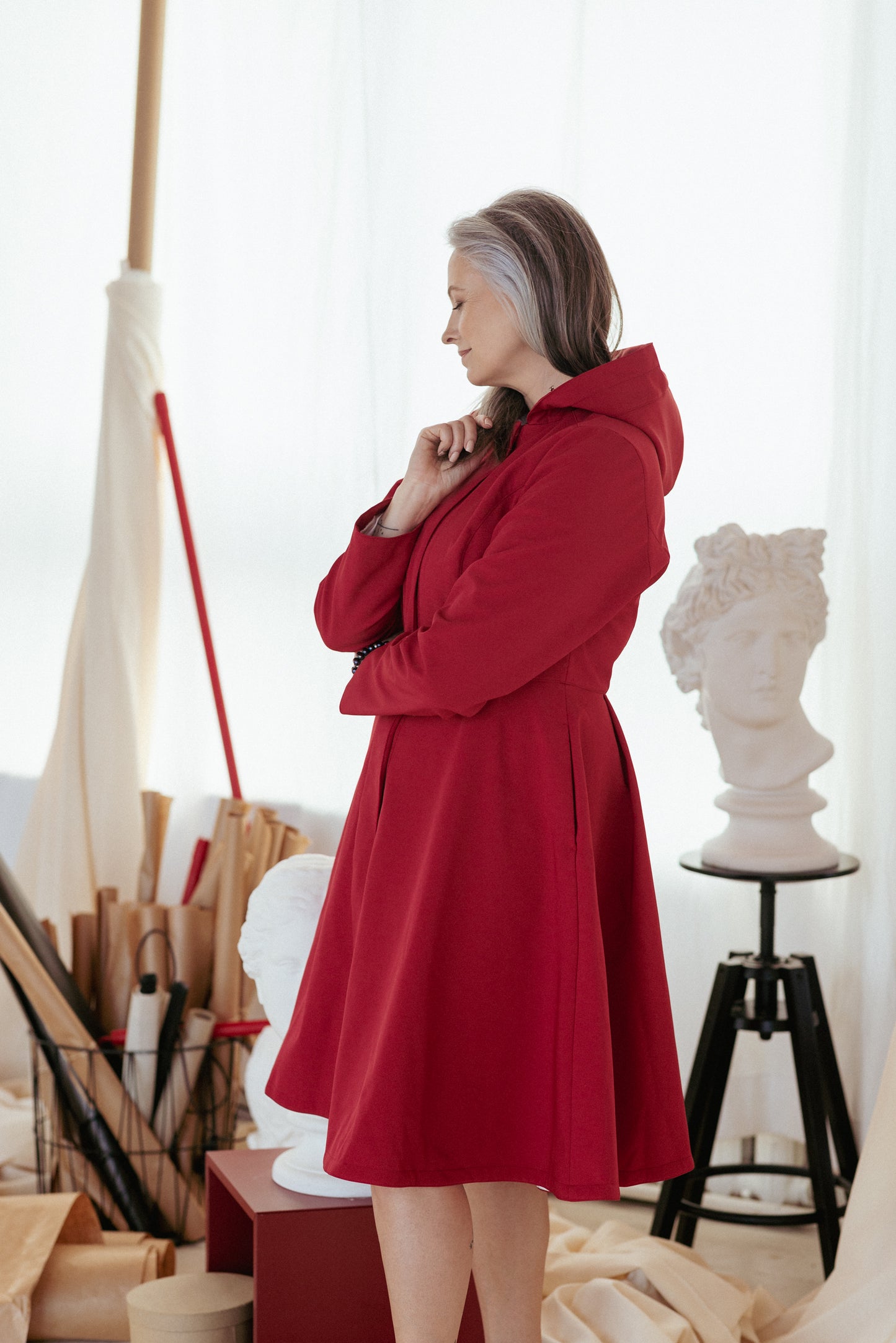 Waterproof Dark Red Coat for Women with full volume skirt and pleating on the back